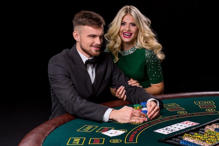 Live casino dealer at table with multiple camera feeds